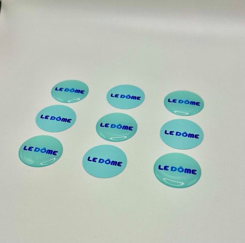 Le Doming : une Finition Haut de Gamme pour Vos Supports Imprimés